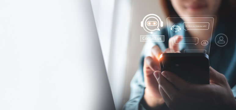 Digital chatbot conversation assistant on smartphone app interface with AI technology providing virtual assistant, customer support. Business woman using mobile phone with chatbot automatic answering