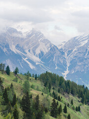 Winter and snowy mountain panorama on a cloudy day showing the raw power of nature in the Dolomites