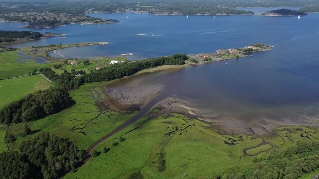 Aerial footage of the fishing village of Mollosund on a sunny day in Orust, Vastra Gotaland, Sweden