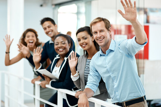 Happy, business people and hand waving to new employee for hello, support and recruitment on office balcony. Smile, corporate group and team with welcome greeting for onboarding and collaboration
