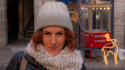 Redhead woman smiles in winter