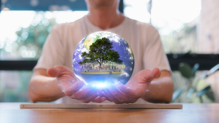 earth day saving world and learning concept, businessman hand holding glob and tree city and field...