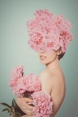 Beauty Blossoming Collage. Composite image woman portrait with Pink Peony Flowers.