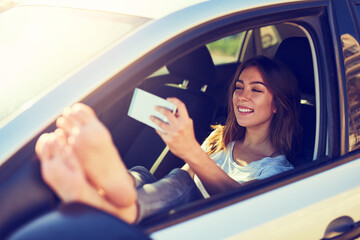 Woman, selfie and phone by car window in summer for travel, freedom or vacation with sunshine...