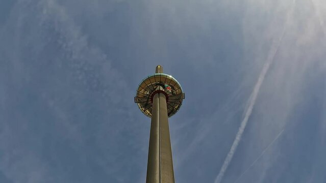 Low angle shot of Brighton i360 seaside tower under blue sky on a sunny day in Brighton, England, UK