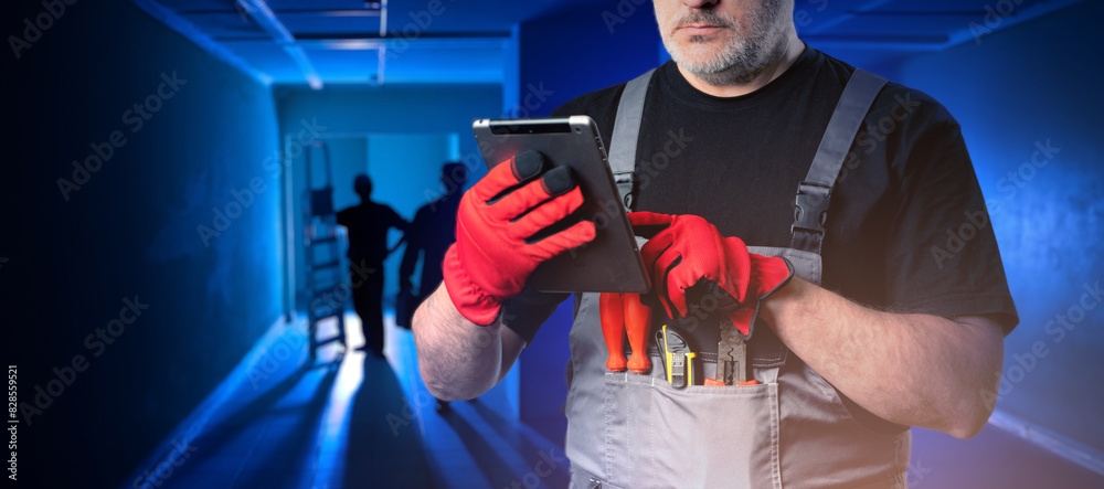 Poster man foreman. construction worker with tablet computer. cropped foreman uses gadget. builder uses int