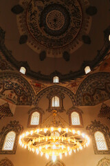 Chandelier and elaborate ceiling decoration, pattern, painting, fresco inside the Sinan Pasha...