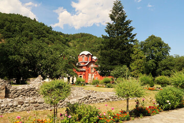Inside the courtyard, garden of the Patriarchate of Pec Monastery, view between the trees onto the...