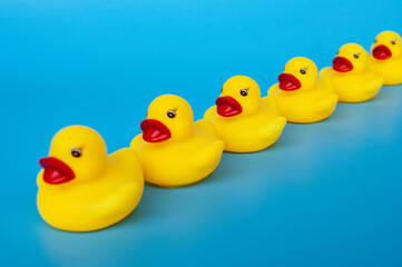 Side view of rubber ducks in line with customizable space for text