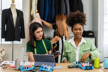 Fototapeta premium Collaboration and creativity in fashion design of teamwork, three diverse and talented designer collaborating on fabric swatches and design choices, creative studio, textile industry, fabric selection