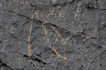Stone texture worn by the wind and the sea of ​​the coast located on a wild beach.