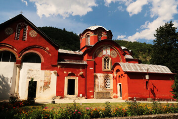 The bright red Church Complex inside the courtyard, garden of the Patriarchate of Pec Monastery,...
