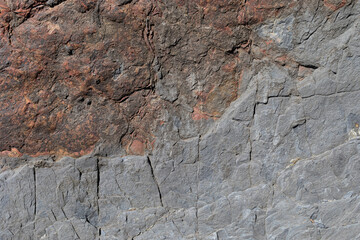 Stone texture worn by the wind and the sea of ​​the coast located on a wild beach.