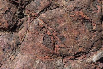Stone texture worn by the wind and the sea of ​​the coast located on a wild beach.