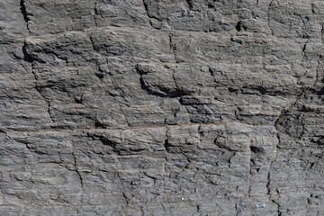 Stone texture worn by the wind and the sea of ​​the coast located on a wild beach.
