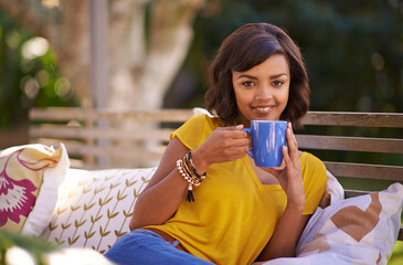Portrait, woman and student with coffee or tea in outdoor for nature, relax and peace for leisure...