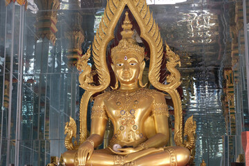 golden buddha statue in thai temple