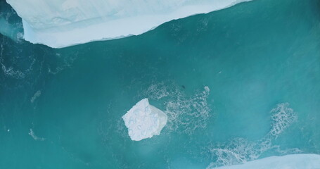 Huge high ice glacier at polar nature environment. Antarctica melting blue water iceberg. Ecology,...