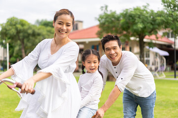 Portrait of enjoy happy love asian family father and mother holding hug cute little asian girl child smiling play and having fun moments good time, care, kid, support, insurance, child, at home