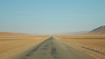 Endless Straight Desert Road Stretching into the Horizon under a Clear Blue Sky, Epitome of Solitude and Freedom in a Barren Landscape, 8K Ultra-Detail