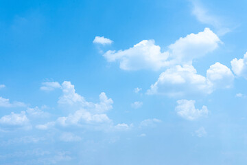 Blue Sky with Fluffy Clouds on a Bright Summer Day