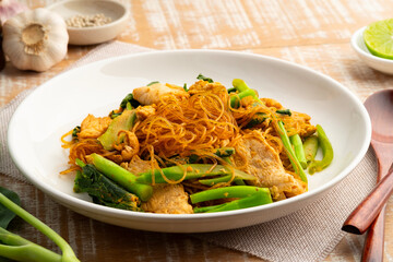 Fried vemicelli with Sweet Black Sauce,stir fry glass noodle with garlic sliced chicken breast kale and chicken egg with soy sauce (Pad See Ew).healthy low calorie meals.Diet food.