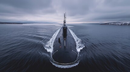 A submarine cruises through calm waters under a cloudy sky, creating a wake as it moves. The distant shoreline and snow-covered mountains add serenity.