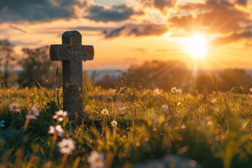 Empty tombstone with cross on sunrise meadow, symbolizing hope and resurrection on good friday