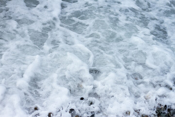Sea wave crashing on the shore