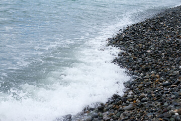 Sea wave crashing on the shore