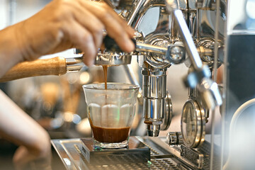 Close up barista making espresso coffee