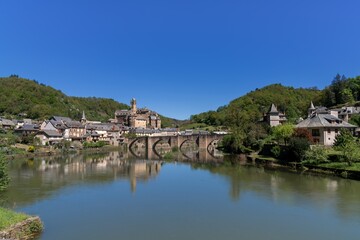 Fototapeta premium view of the picturesque French village of Estaing on the Lot River in south central France
