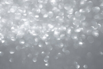 Defocused silver glitter, bokeh balls texture, abstract backdrop
