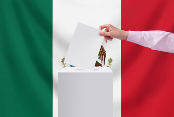 Elections, Mexico. Election concept. The voter throws the ballot into the box.
