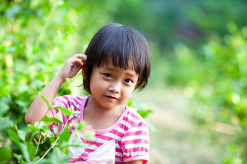 Asian cute girls sitting in the jasmine garden, Happy mother day concept