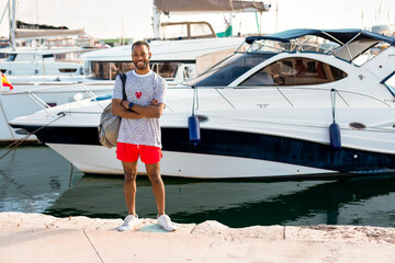 Young Entrepreneur Standing in Front of His New Boat: Business Concept