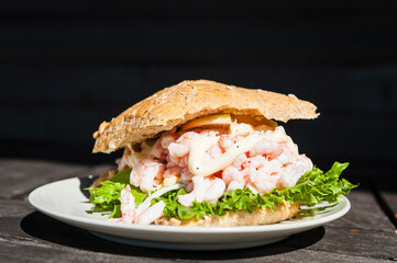 White Plate With Sandwich on Wooden Table