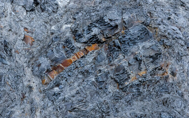 A layer of the mineral opal in the volcanic rock of the mountain of the ancient volcano Karadag