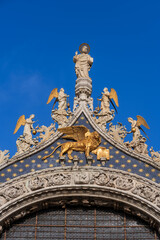 Winged Lion Of Saint Mark And Angels At Venice Basilica In Italy
