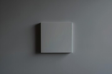 The essence of simplicity in design: a perfectly symmetrical square against a minimalist gray background, embodying the elegance of minimalist aesthetics.