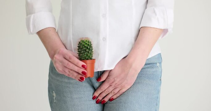 Female body and cactus against background of internal organs symbolizes female pains. Uterus and ovaries and pain