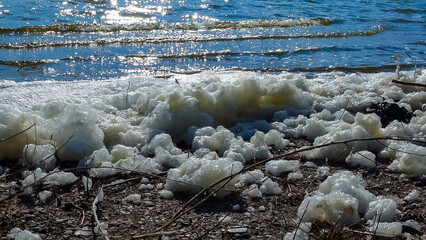 Environmental problem and pollution, eutrophication of a natural reservoir, dirty foam on the...