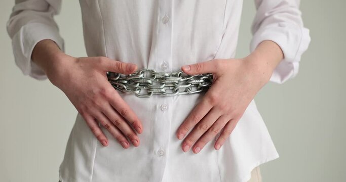 Young woman suffers from abdominal pain and a chain around belly. Gynecology or food poisoning