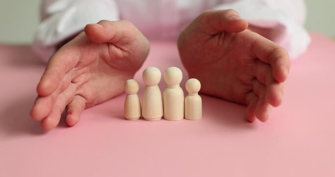 Women hands protect family with children. Well-being and comfort of modern family