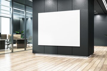 A large blank white poster on a black wall in an office lobby, wood floor, and glass, modern corporate branding concept. 3D Rendering