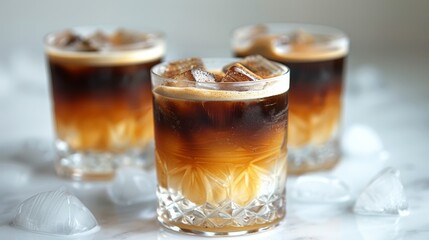 Frozen espresso ice cubes arranged in a glass with layers of strong black coffee and a touch of vodka, high contrast and clarity