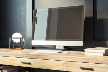 A modern computer monitor on a wooden desk, with minimalist decor and a dark background, embodying a clean and professional workspace. 3D Rendering