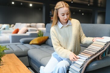 Obraz premium young woman shopping for furniture, sofa and home decor in store