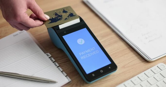 Closeup of woman hand holding credit card and approved payment. Cashless payment method