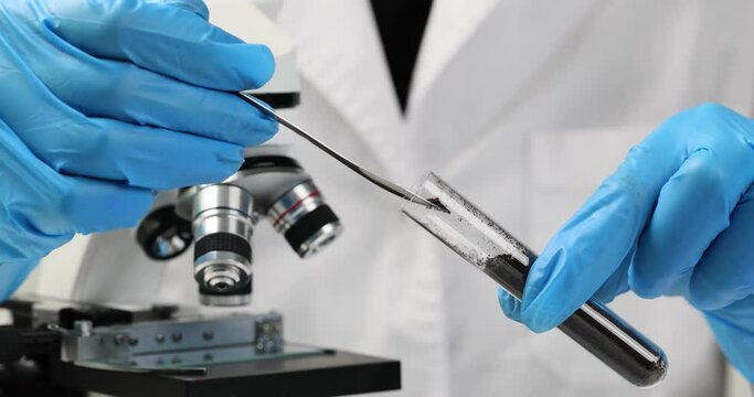 Test tube with soil sample in chemical laboratory closeup. Biochemical analysis of soils concept